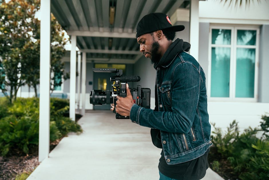 Wedding videographer holding professional camera